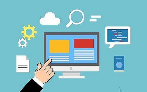 Website-Baukasten Hand deutet auf Monitor